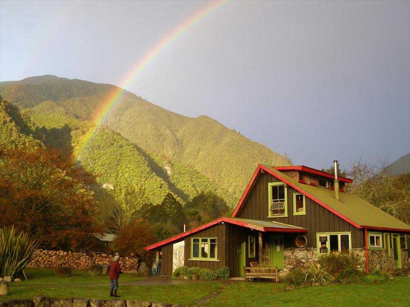 A rainbow over the community house at Rainbow Community